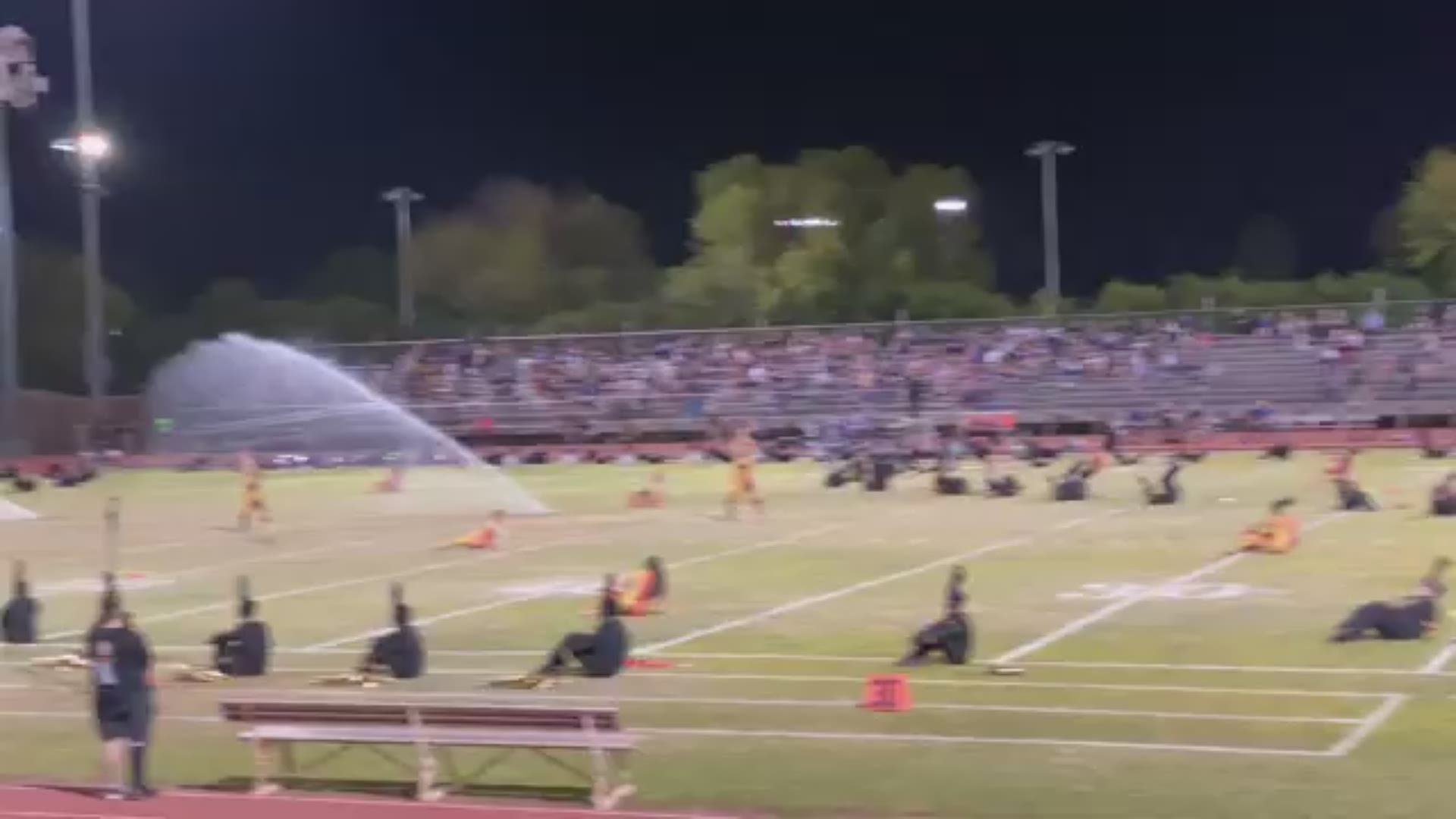 The Corona del Sol High School marching band was surprised with an unexpected sprinkler incident during their halftime performance.