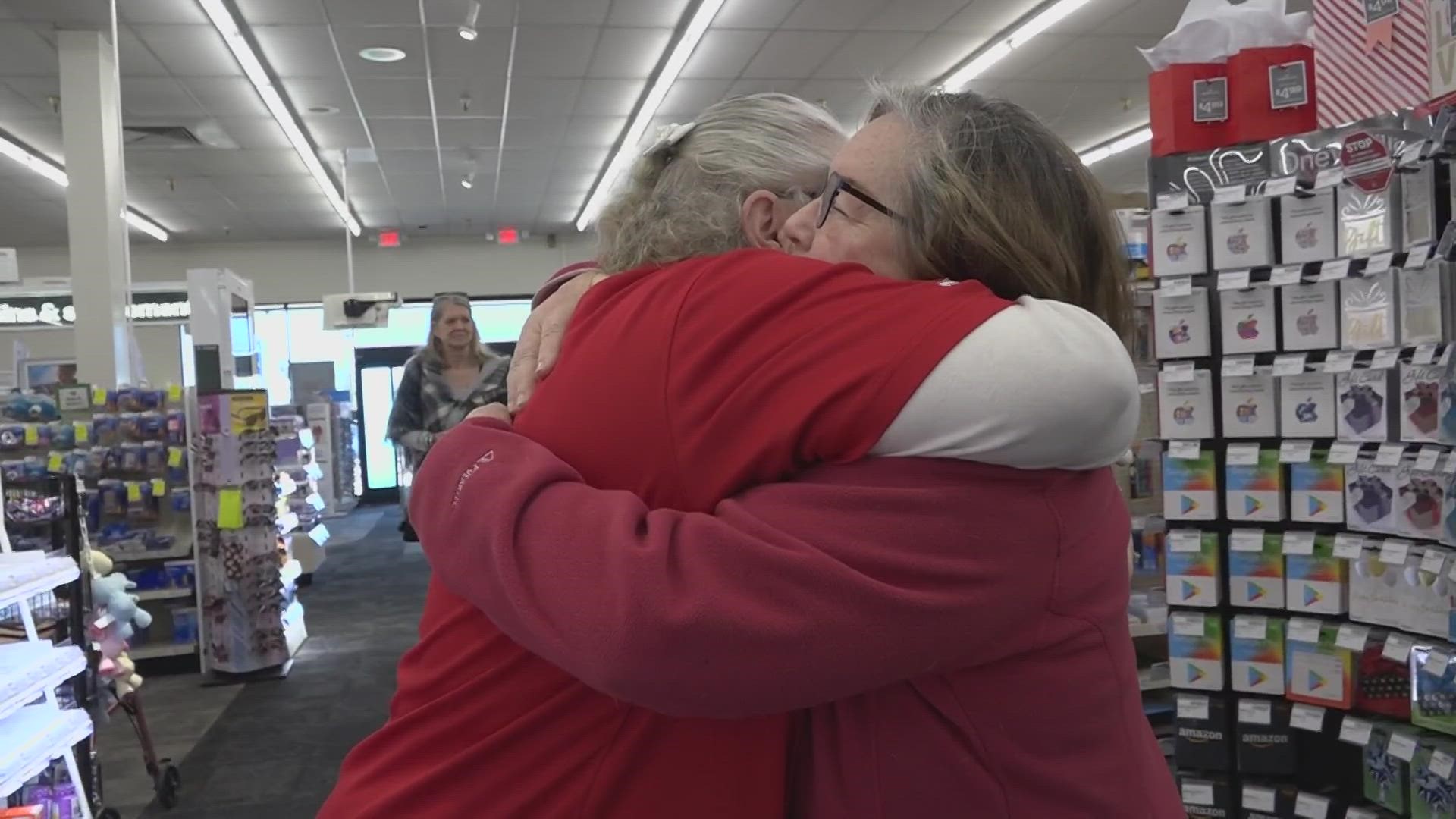 Many hugs were shared at a Scottsdale CVS when a husband and wife who were nearly swindled out of their savings thanked a store worker there who saved them.