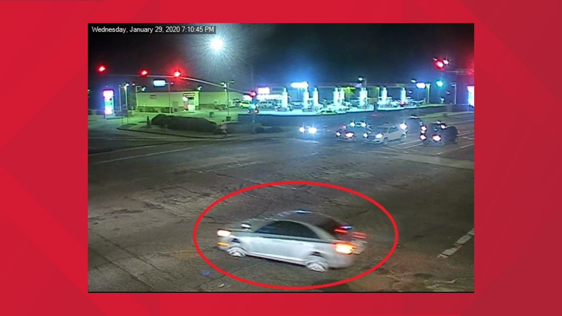 Police are looking for a silver four-door sedan that was caught on a red light camera as the car fled the scene of a shooting near Westgate over a parking space