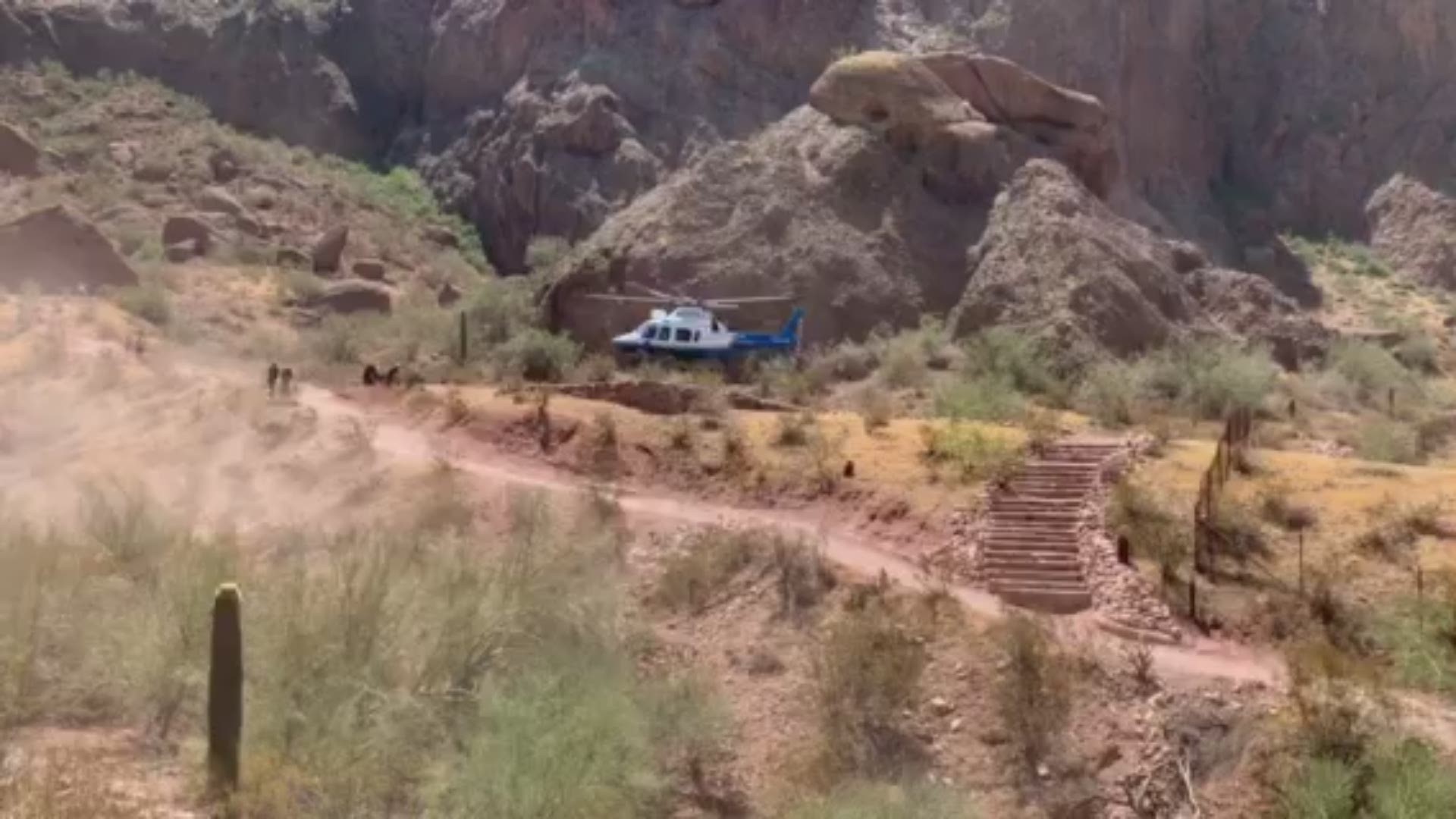 Phoenix Fire crews airlifted two hikers suffering from heat-related symptoms off of Camelback Mountain on Friday, as temperatures reached 108 degrees. (Video: Phoenix Fire Department)