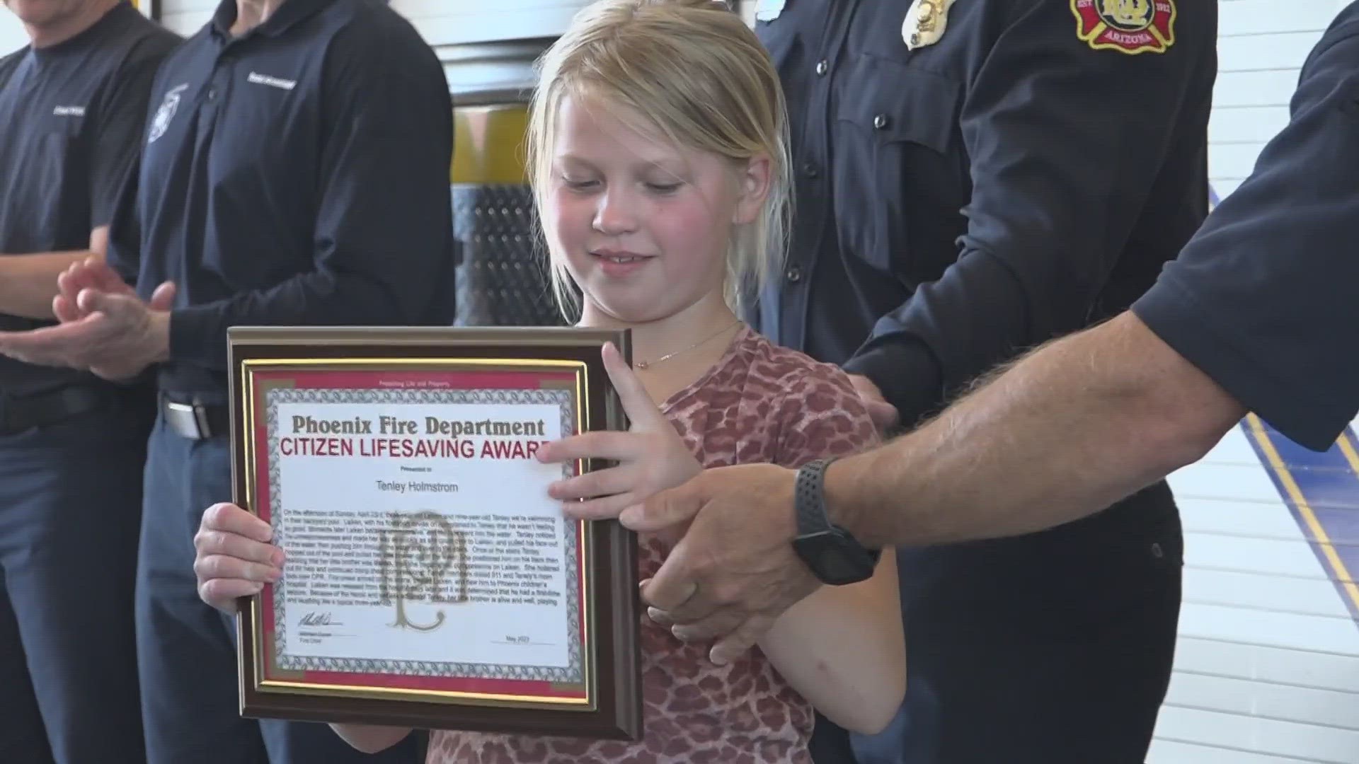 Nine-year-old Tenley Holmstrom from Glendale is honored for saving her baby brother from drowning.