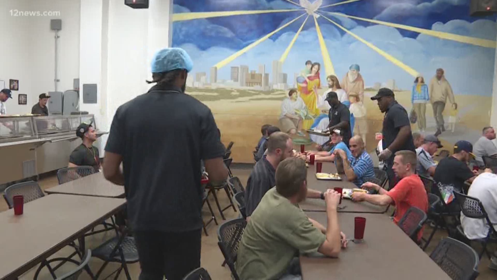 Arizona Rattlers player serve dinner at Phoenix homeless shelter
