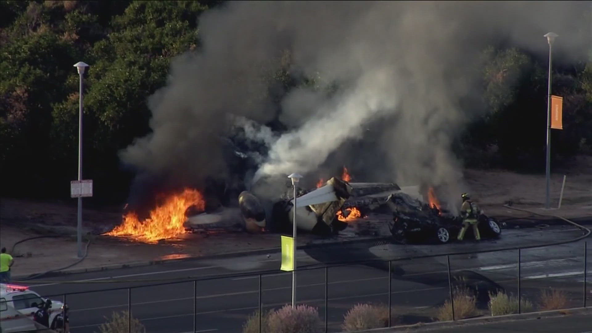 Five people are dead after a plane crashed into a car near Falcon Field, according to the Mesa Fire Department.