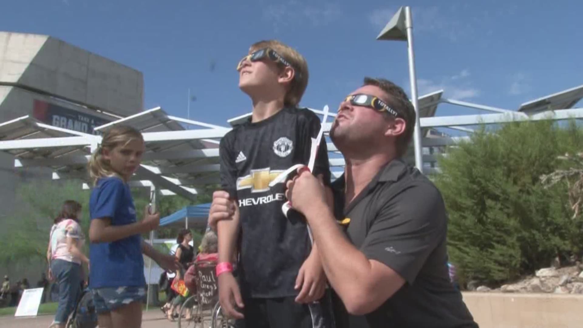 The Arizona Science Center was at capacity as thousands of parents and kids stood outside to catch the historic view of the total solar eclipse.