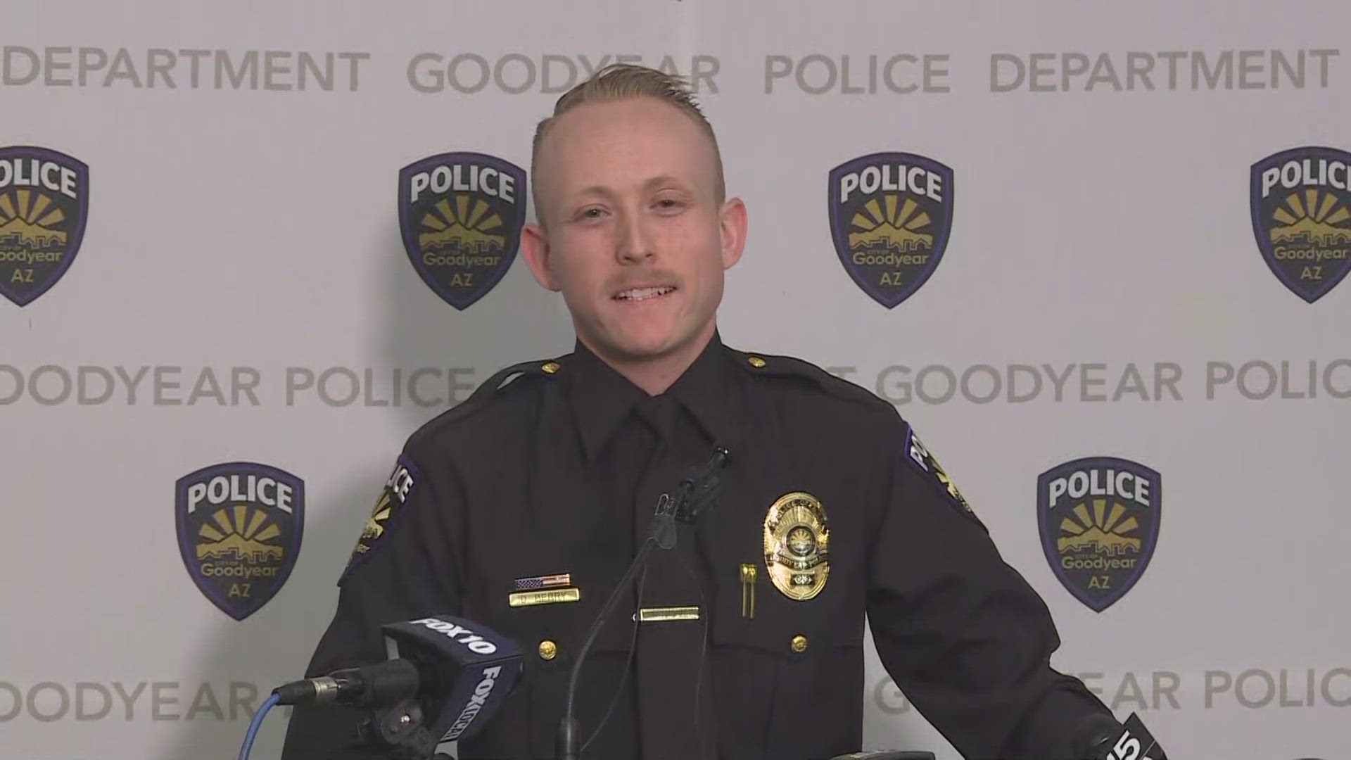 A Goodyear police officer risked his life on Sunday to save a woman who was trapped in her car after a multiple-vehicle crash.
