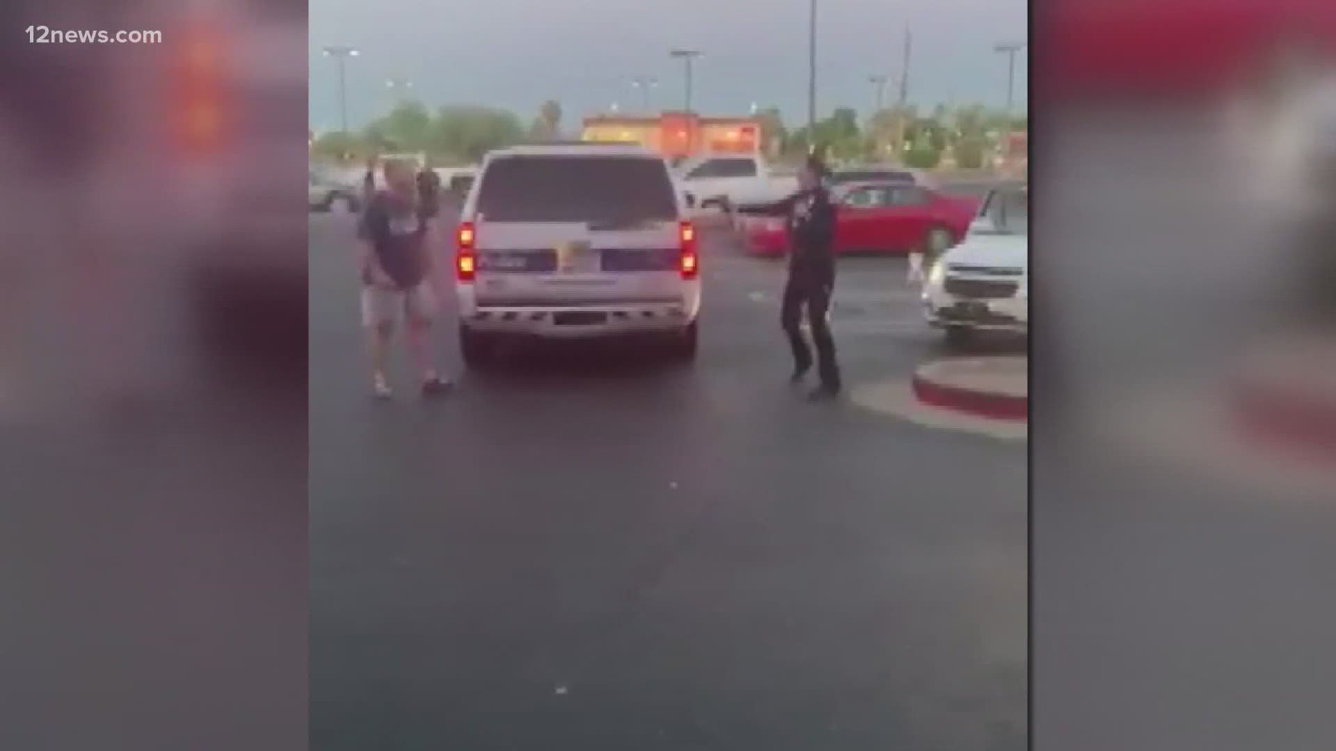 A video shared by Phoenix City Councilman Sal DiCiccio on social media shows a Phoenix officer backing up around her SUV as a man holding a knife moves towards her.