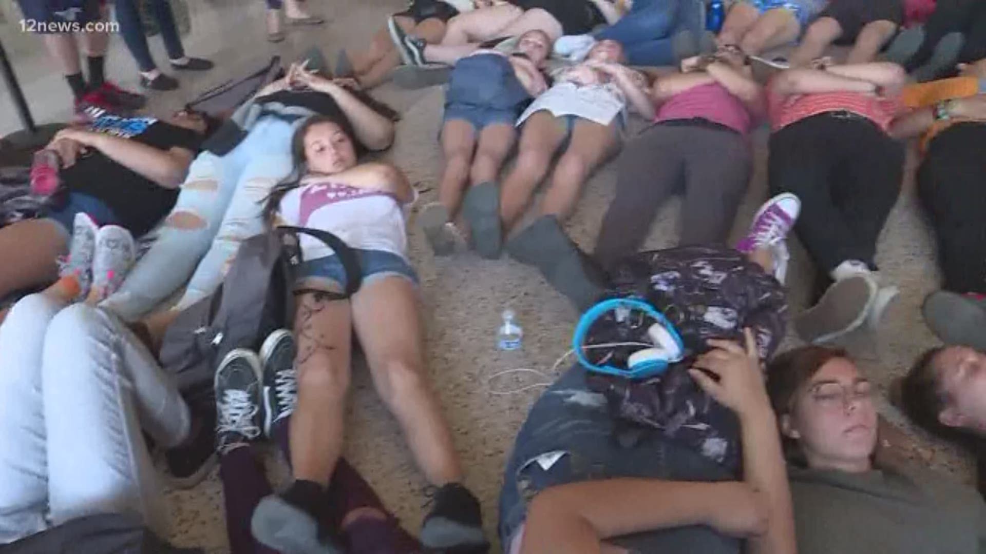 Students staged a "die-in" on the floor of the State Capitol to protest gun violence. .