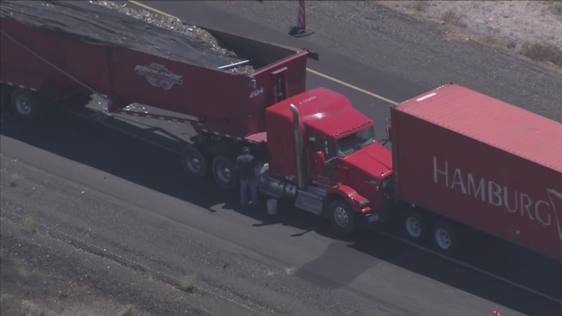 The crash occurred near milepost 98 and one of the involved semi's has caught fire.