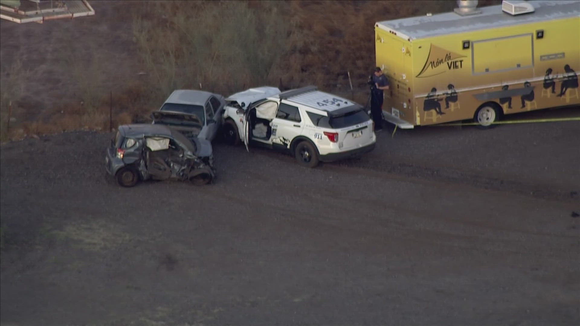 One person died and a police officer was hospitalized after a crash in Apache Junction.