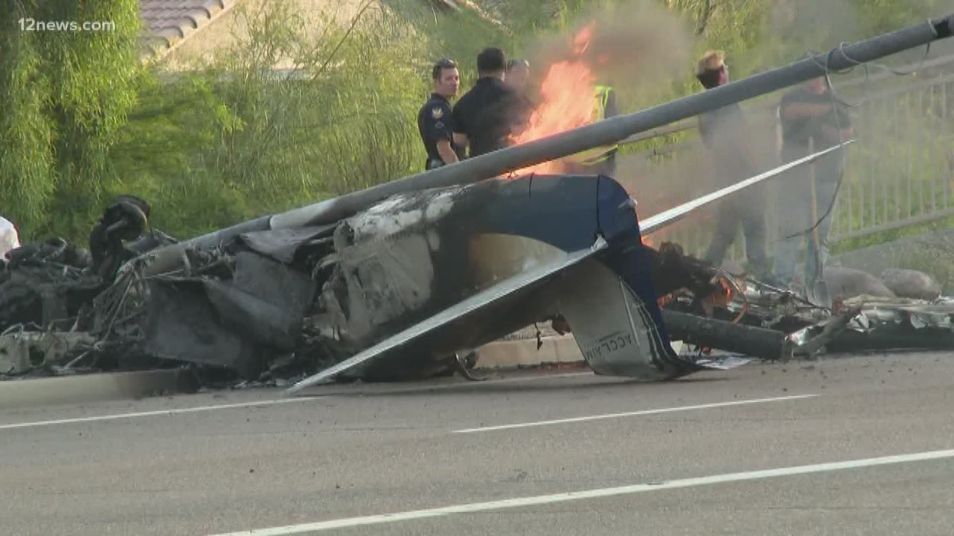 Officials continue to investigate what caused a small plane to crash on a busy street in North Phoenix Tuesday. The 50-year-old pilot is still in critical condition and one Good Samaritan is being called a hero for pulling the pilot out of the burning wreckage.