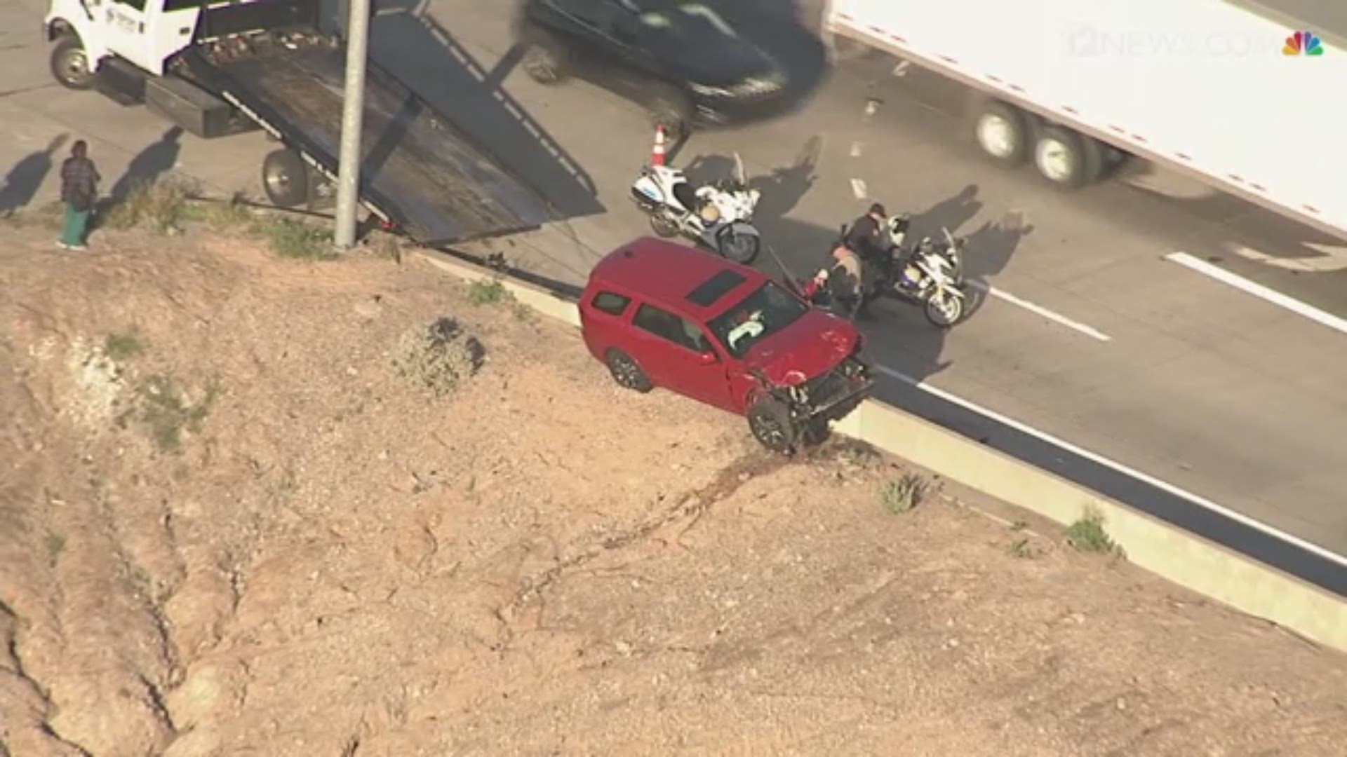 Sky 12 captured footage of the car sitting on top of the concrete barrier.