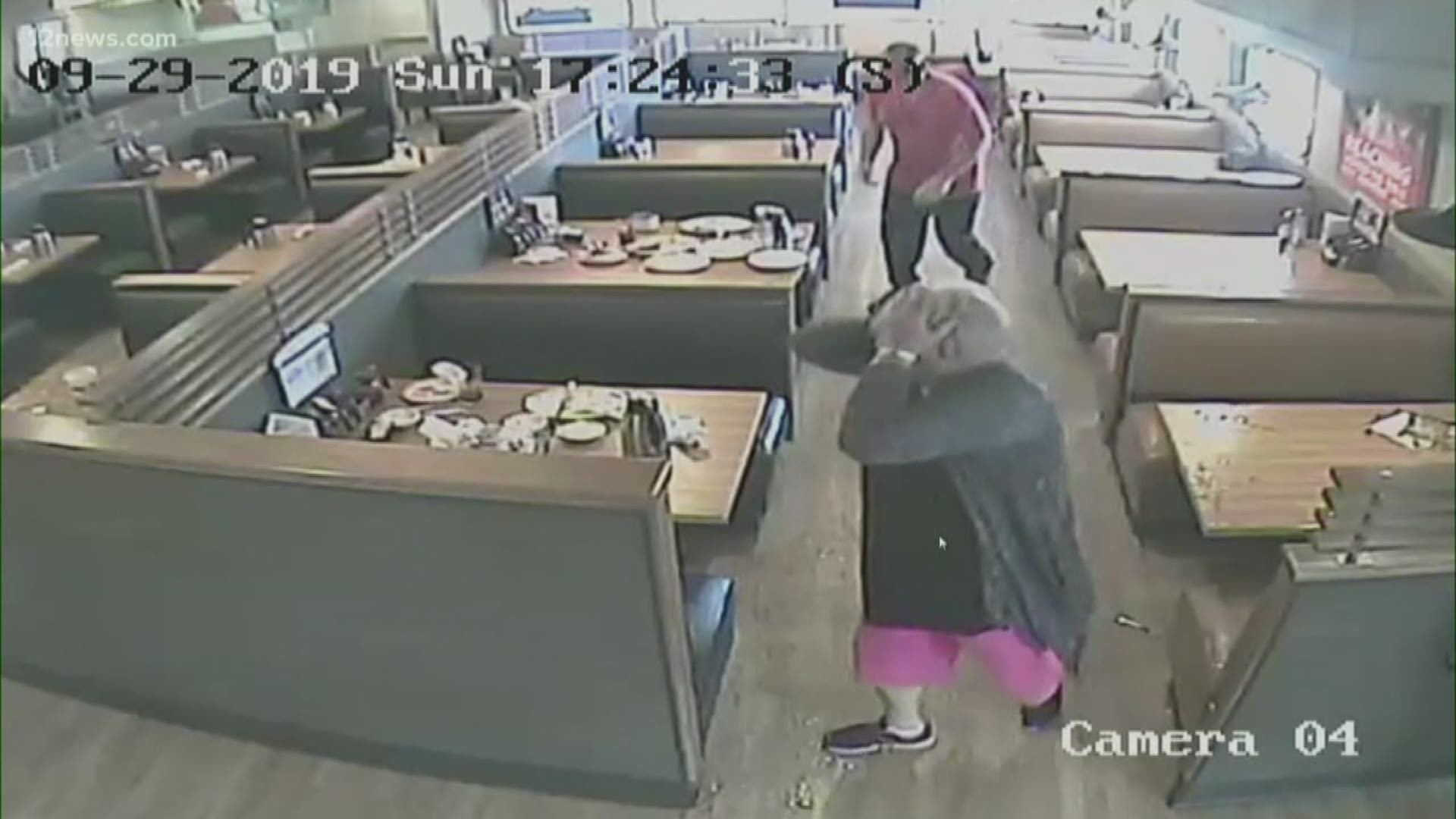 Surveillance video shows a man beating customers at a Phoenix IHOP and then rummaging through their things.