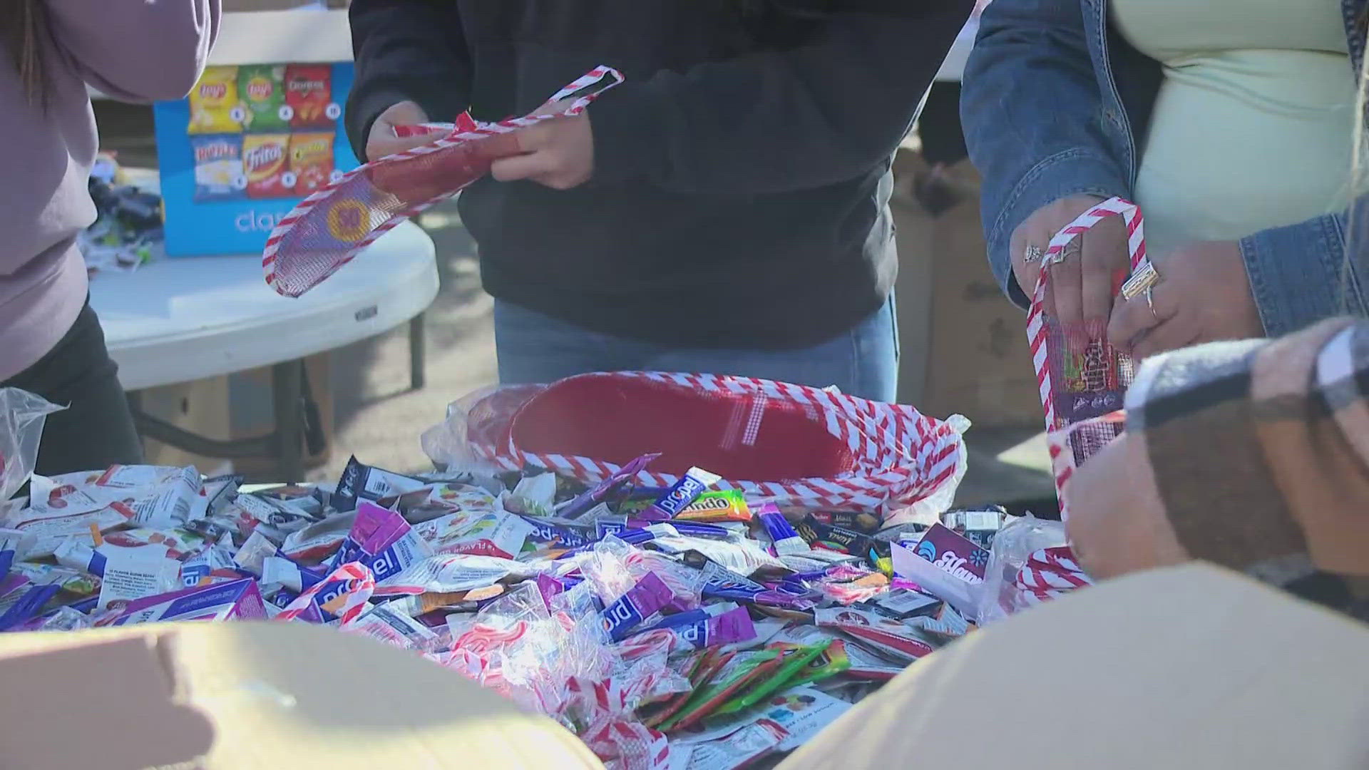 On Tuesday, nearly 100 volunteers with Chicanos Por la Causa filled thousands of stockings with toys for Valley children.