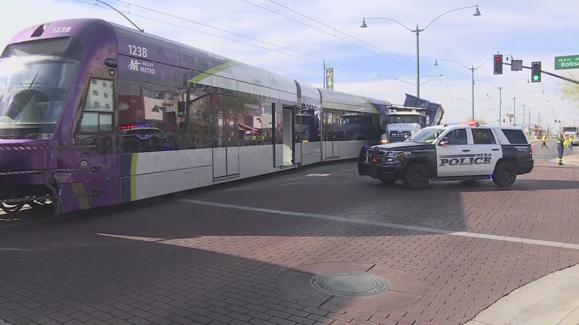 Mesa police are still investigating why the light rail operator could have ran the red light.