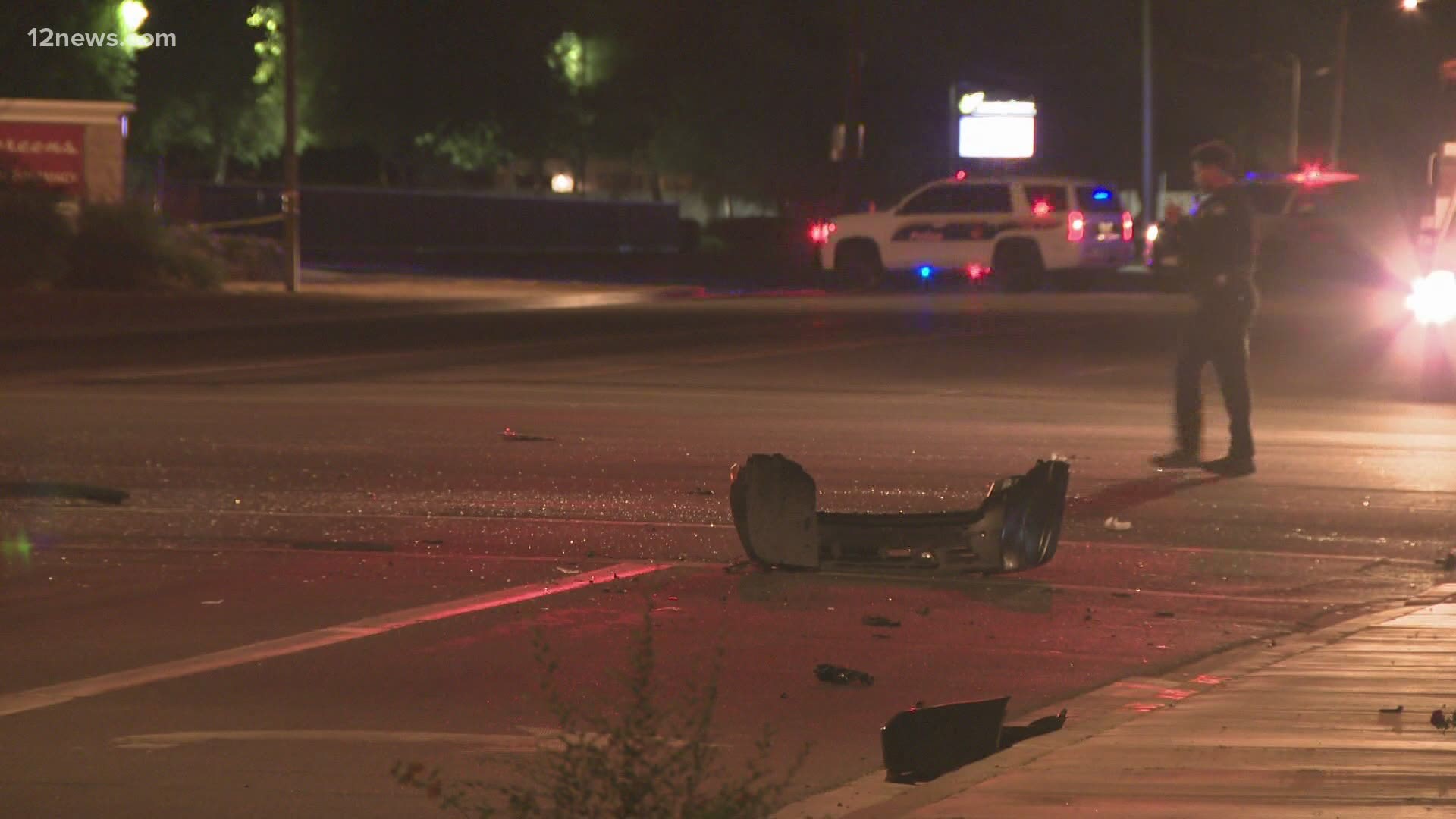 Phoenix PD said witness statements indicate two vehicles were street racing when one crashed into a Jeep making a left turn. The driver of the Jeep was killed.