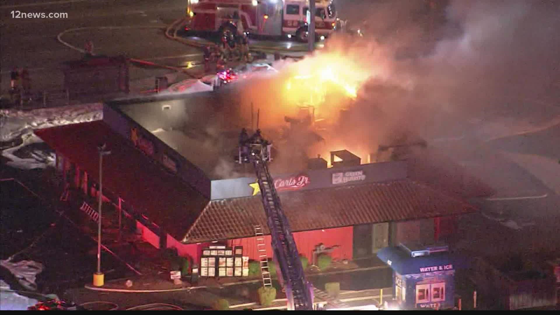 Hot spots have been extinguished at the restaurant fire overnight, firefighters said. No one was injured and officials are investigating the cause.