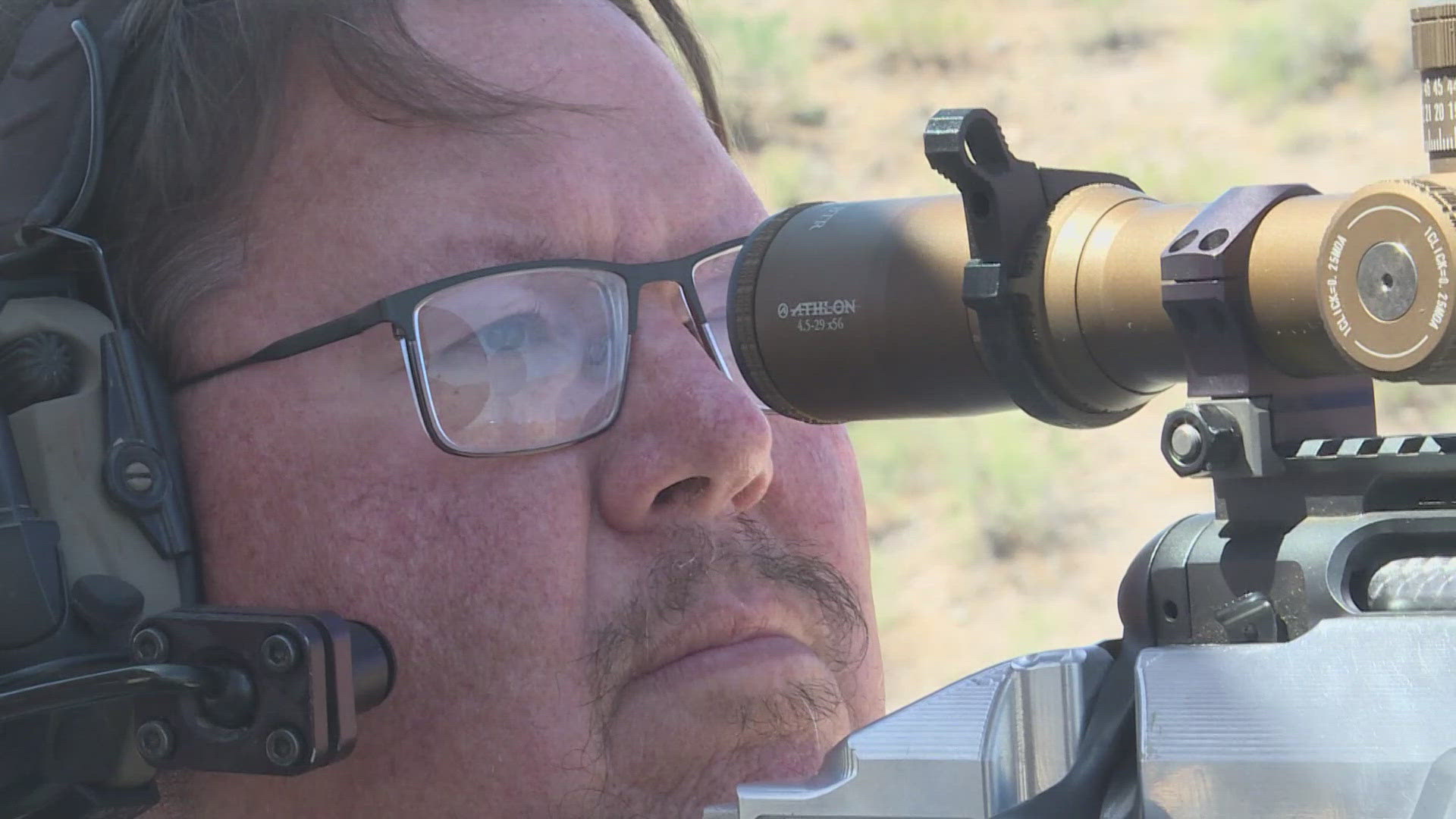 Ryan Kinnear retrofitted his wheelchair to hold and fire his rifle.