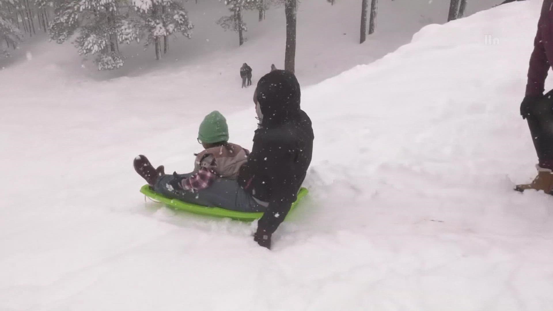 Snow is falling in Arizona’s high country. In Flagstaff people are coming out to enjoy the fresh powder.