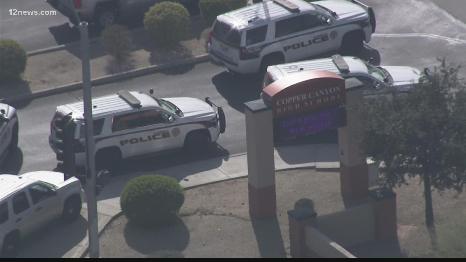 A high school in Glendale was on lockdown Thursday after police received reports that someone brought a gun onto campus. The suspect is in custody.