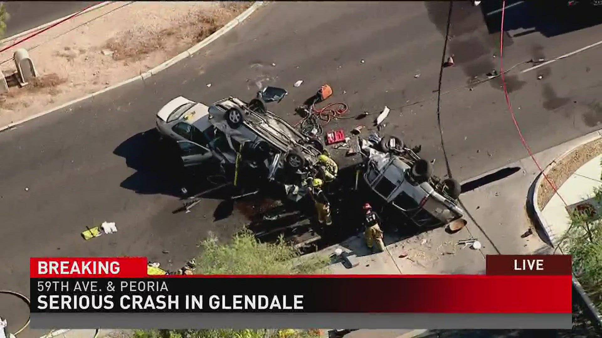 Sky 12 over the intersection of 59th Ave and Peoria where 3 people have been taken to the hospital after a serious accident.