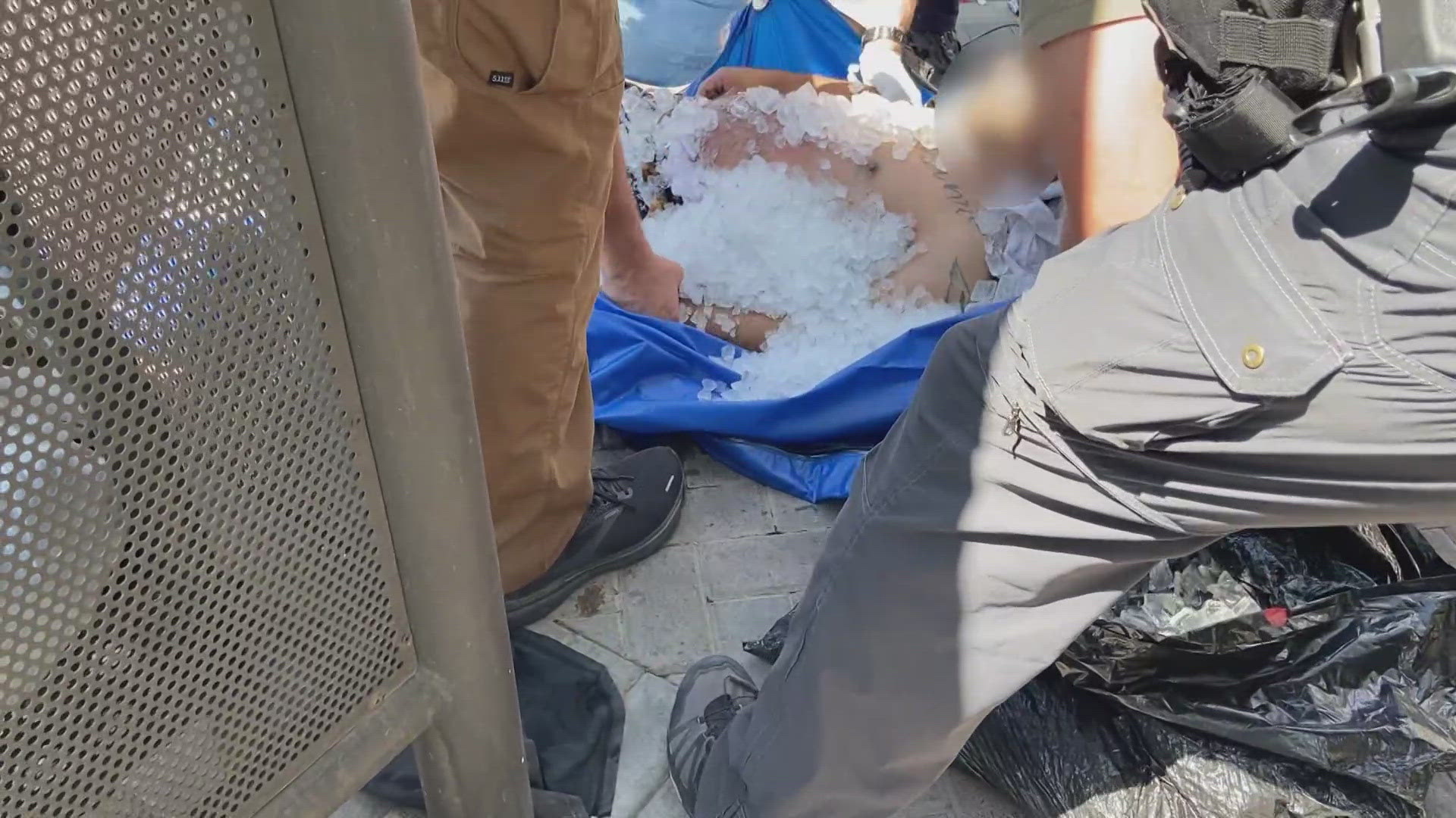 Firefighters in Tempe use cold water immersion bags to help people suffering from heat exposure