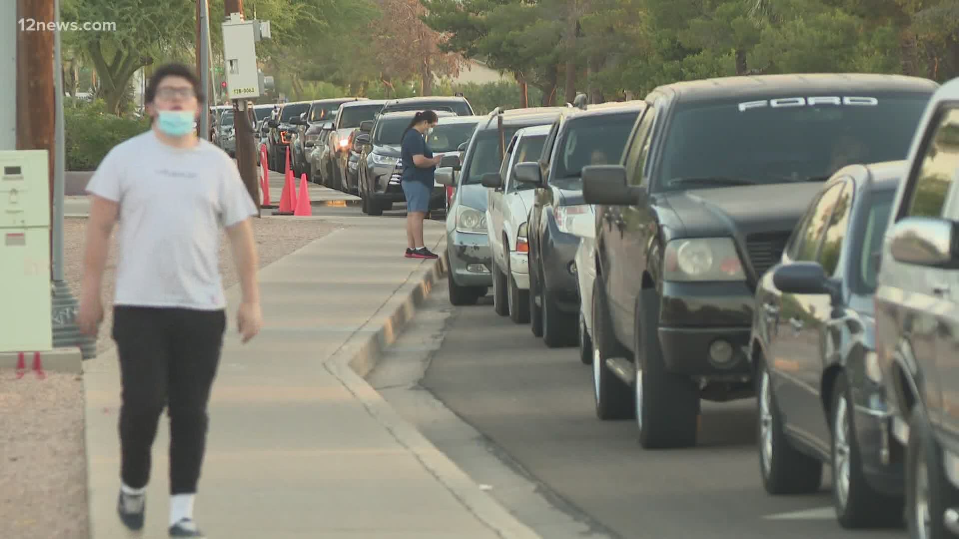 In South Phoenix for the second day in a row, vehicles were lined up with people waiting for hours to get tested for COVID-19.