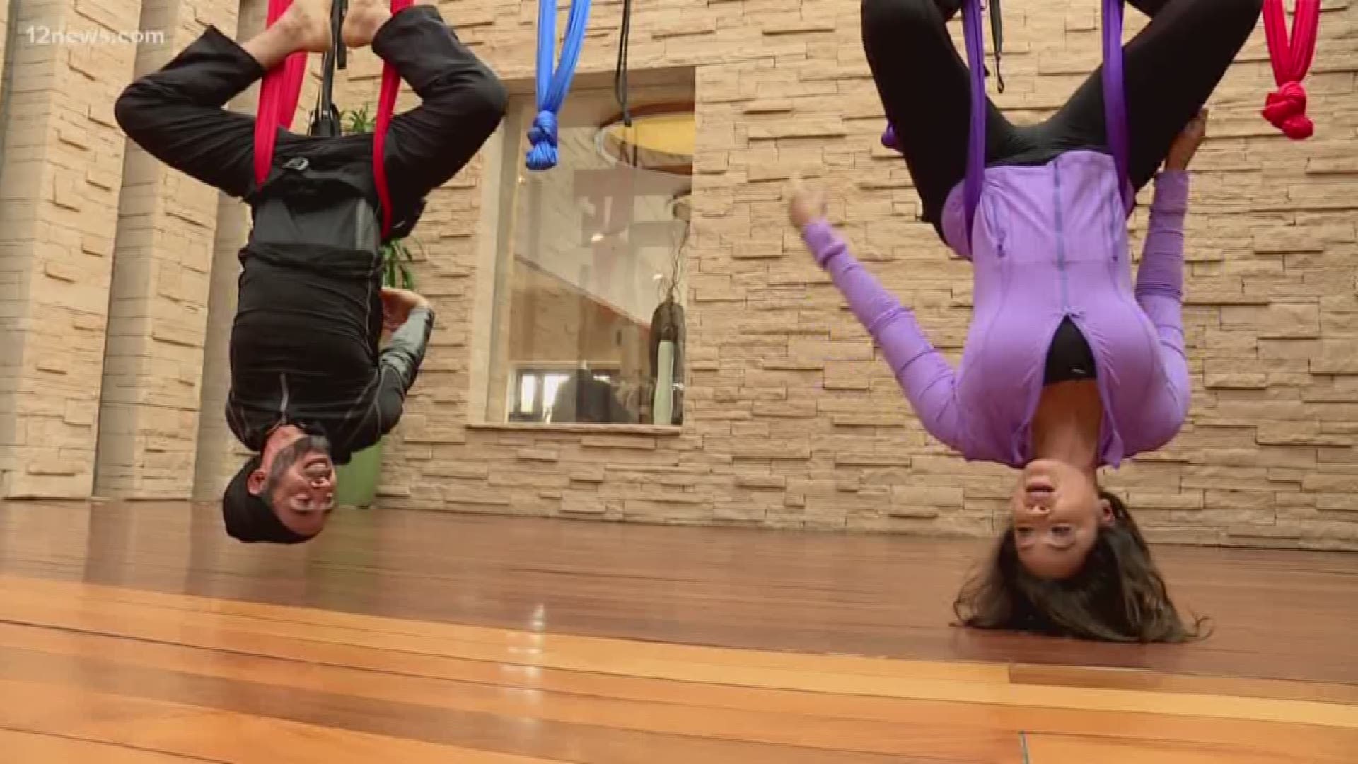 There are all kinds of workouts but only a few allow you to "hang out" while you get your sweat on. Check out aerial yoga for a unique kind of workout.