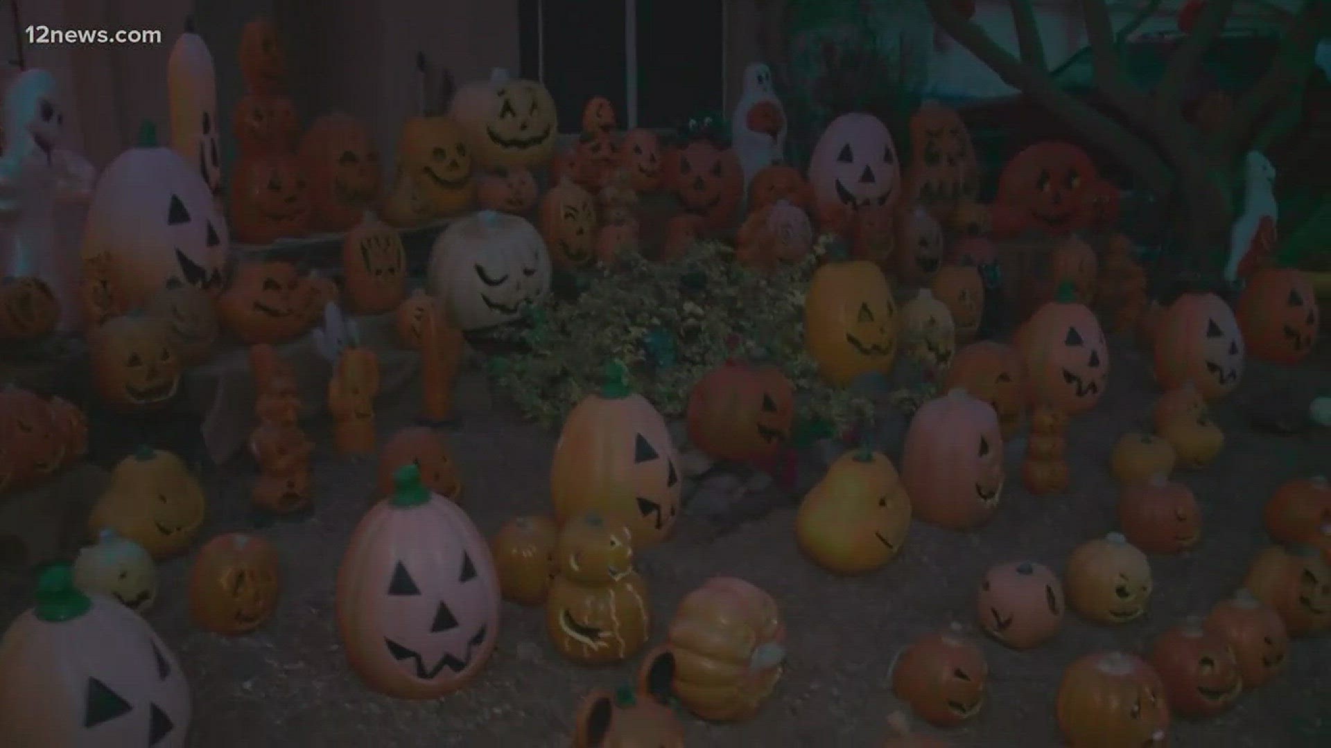 The show at a Phoenix home features music, lights and more than 100 pumpkin faces.