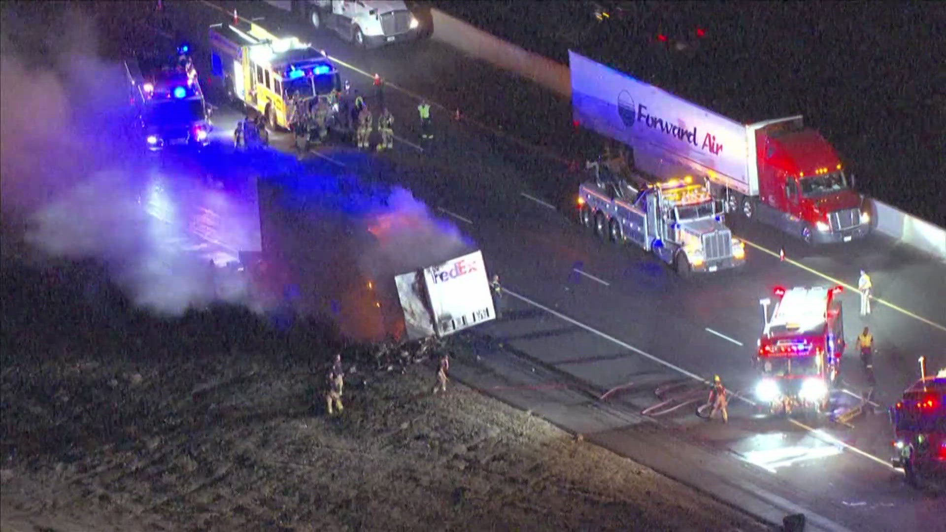 Footage from Sky12 shows flames coming from the trailer and emergency officials on scene.