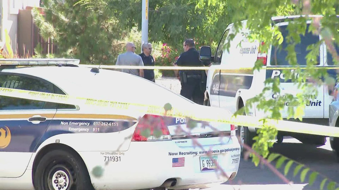 2 detained, Phoenix police officer shot multiple times