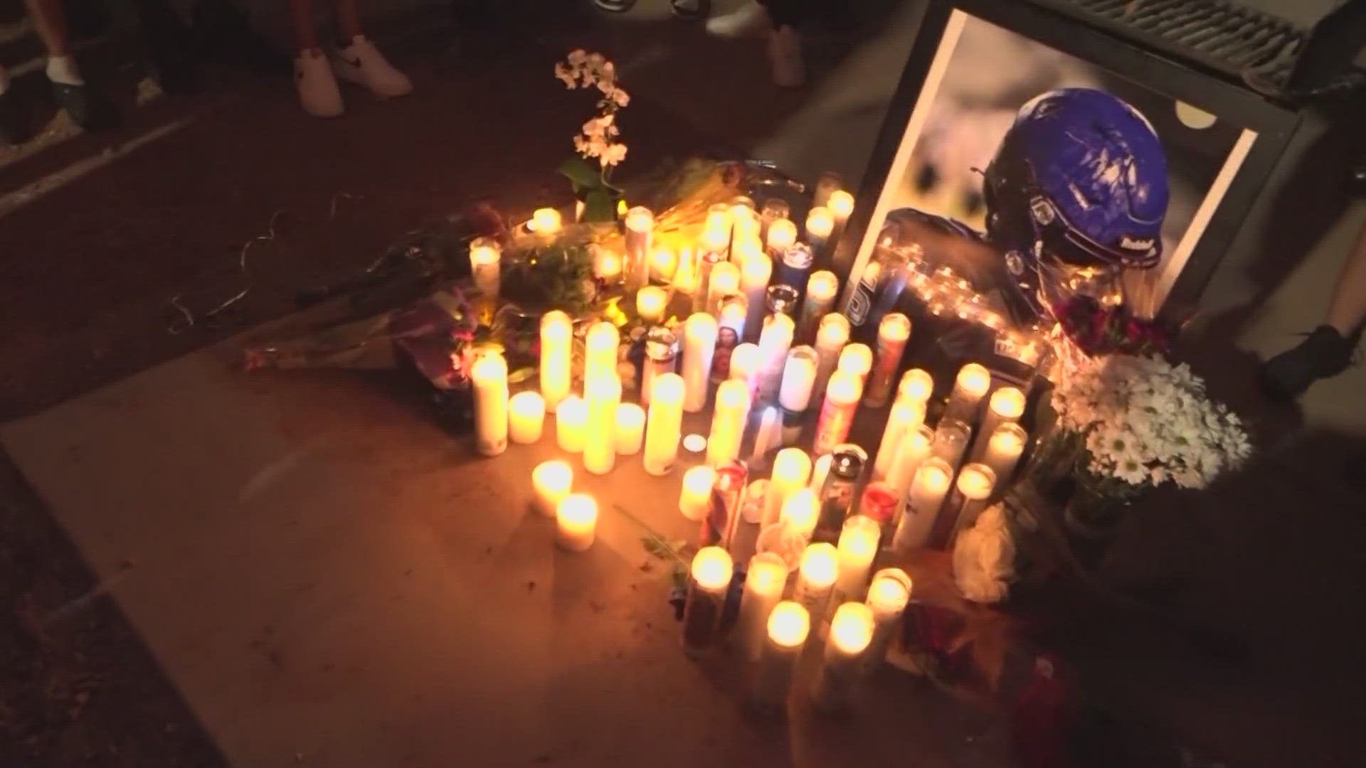 Dozens attended a candlelight vigil to remember Christopher Hampton who died at Show Low Lake.