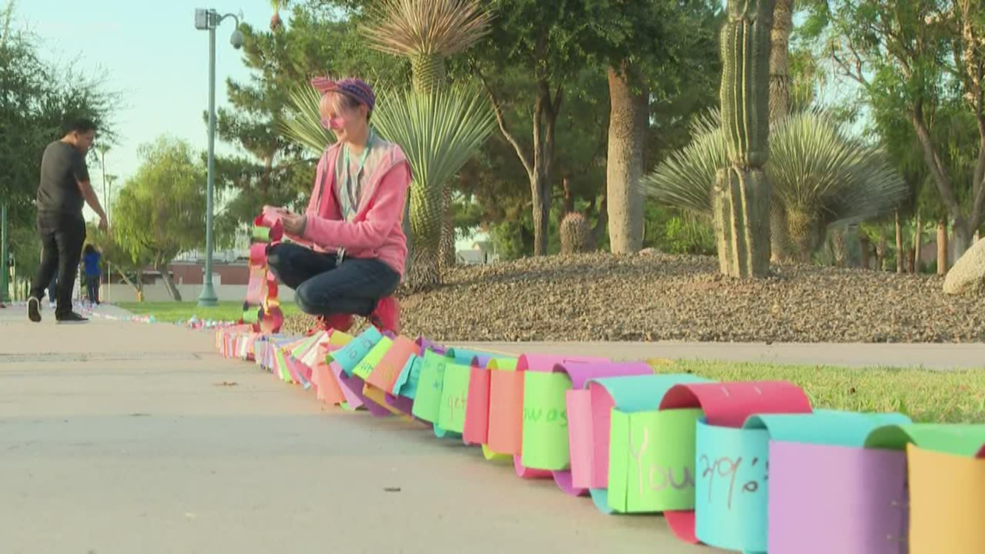Maricopa County high school students hand-wrote messages of hope and transformed them into paper-links as part of Teen Suicide Awareness Month. The messages were stretched around Arizona's State Capitol and will now go back to the schools that made them so students can tear a message off if they need one.