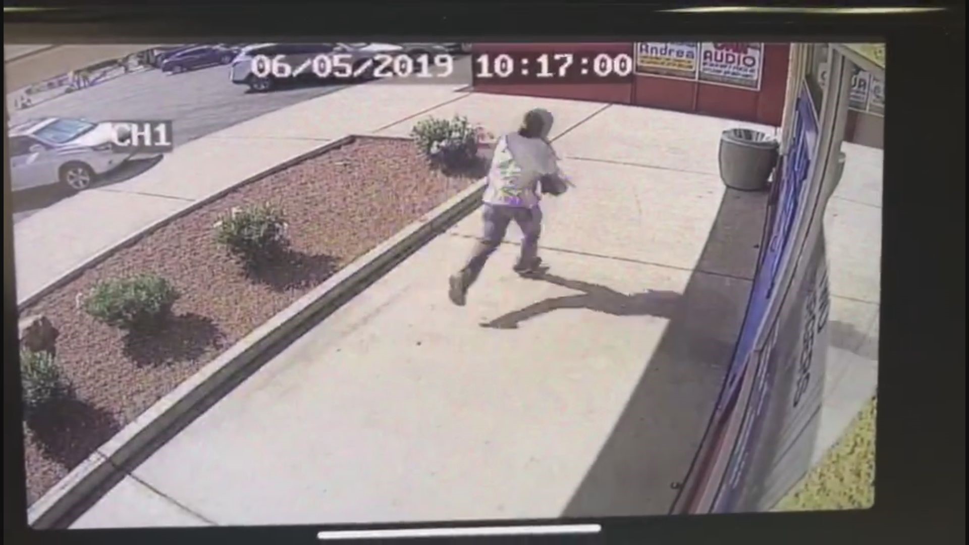 A man was caught on security camera at a neighboring business after police say he shot a nail salon owner as he tried to rob a woman near 51st Avenue and McDowell Road.