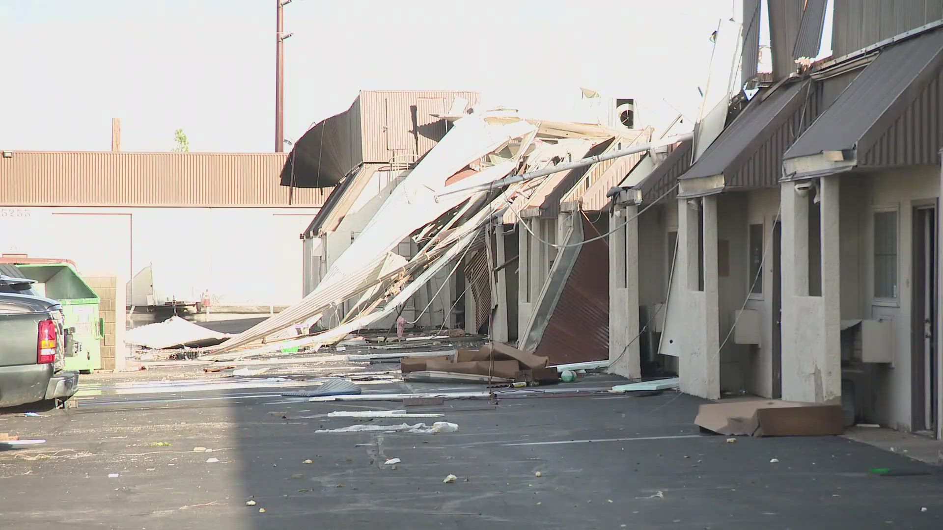 Debris from the damaged roof could be seen strewn about the parking lot following Monday's storm.