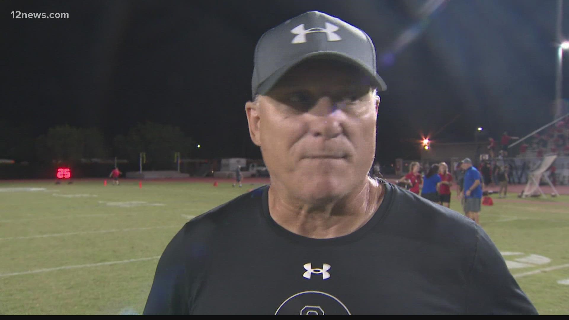 Chandler's head coach, Rick Garretson and Blaine Hipa speak after a 41-21 victory over Liberty.