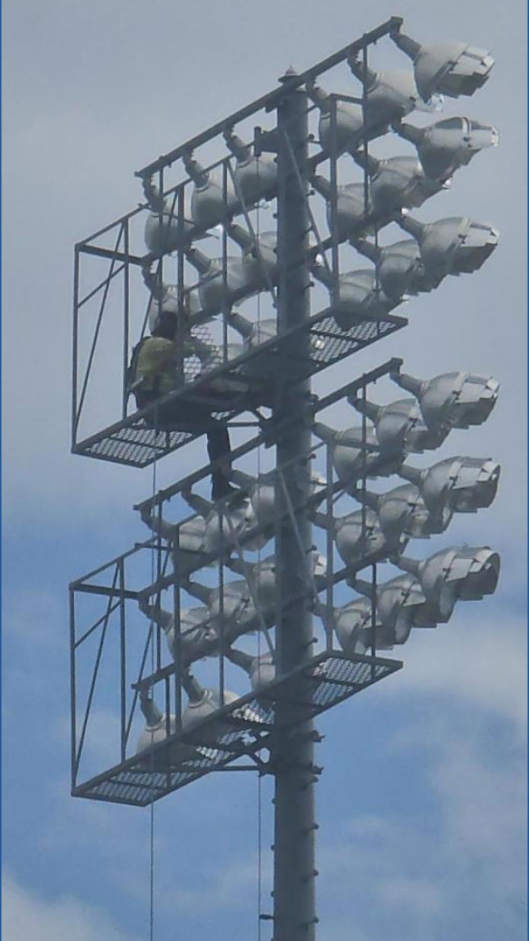 Worker stuck atop light pole at Hohokam Stadium in Mesa | 12news.com