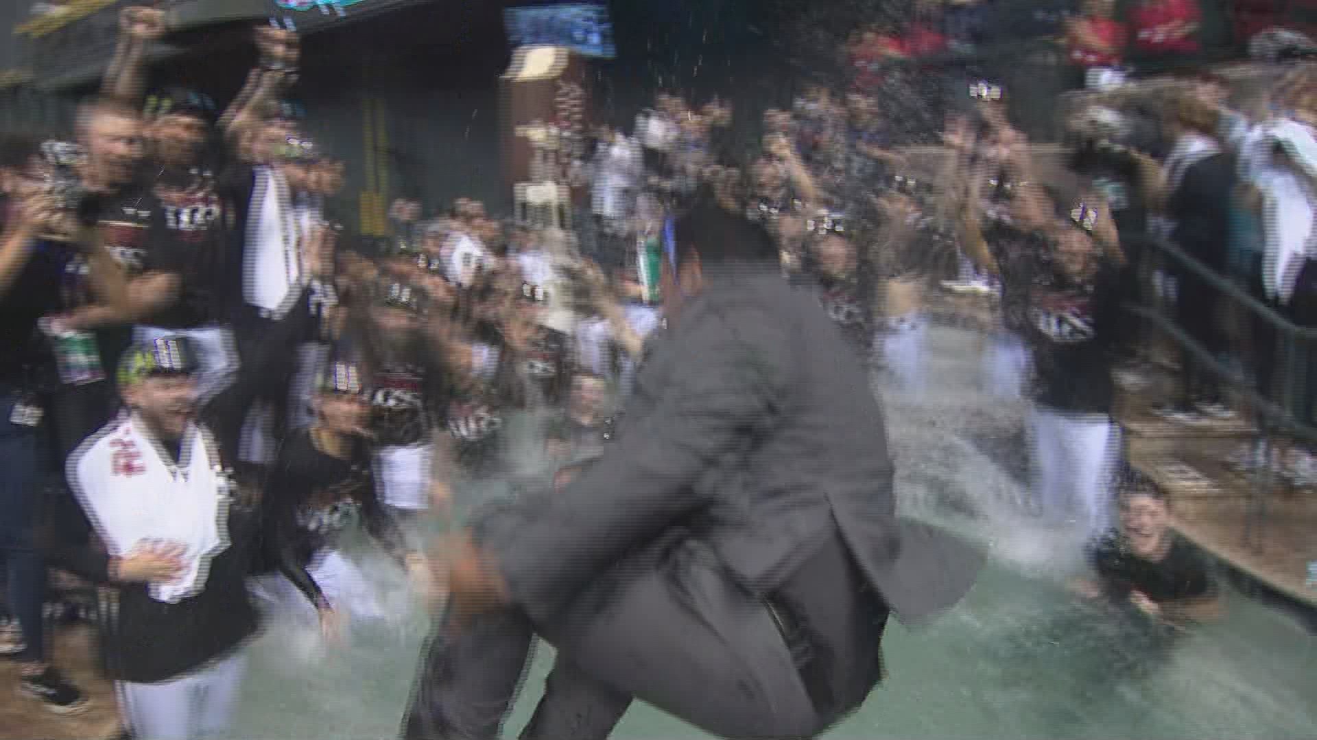 12News' Cameron Cox joined the D-backs NLDS sweep celebration by jumping into the Chase Field pool with the team
