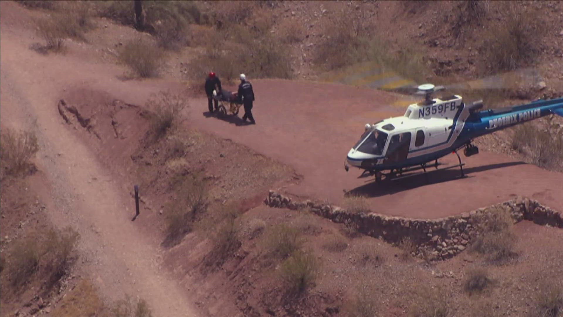 Two hikers were able to walk down the mountain with help but one had to be flown off the mountain.