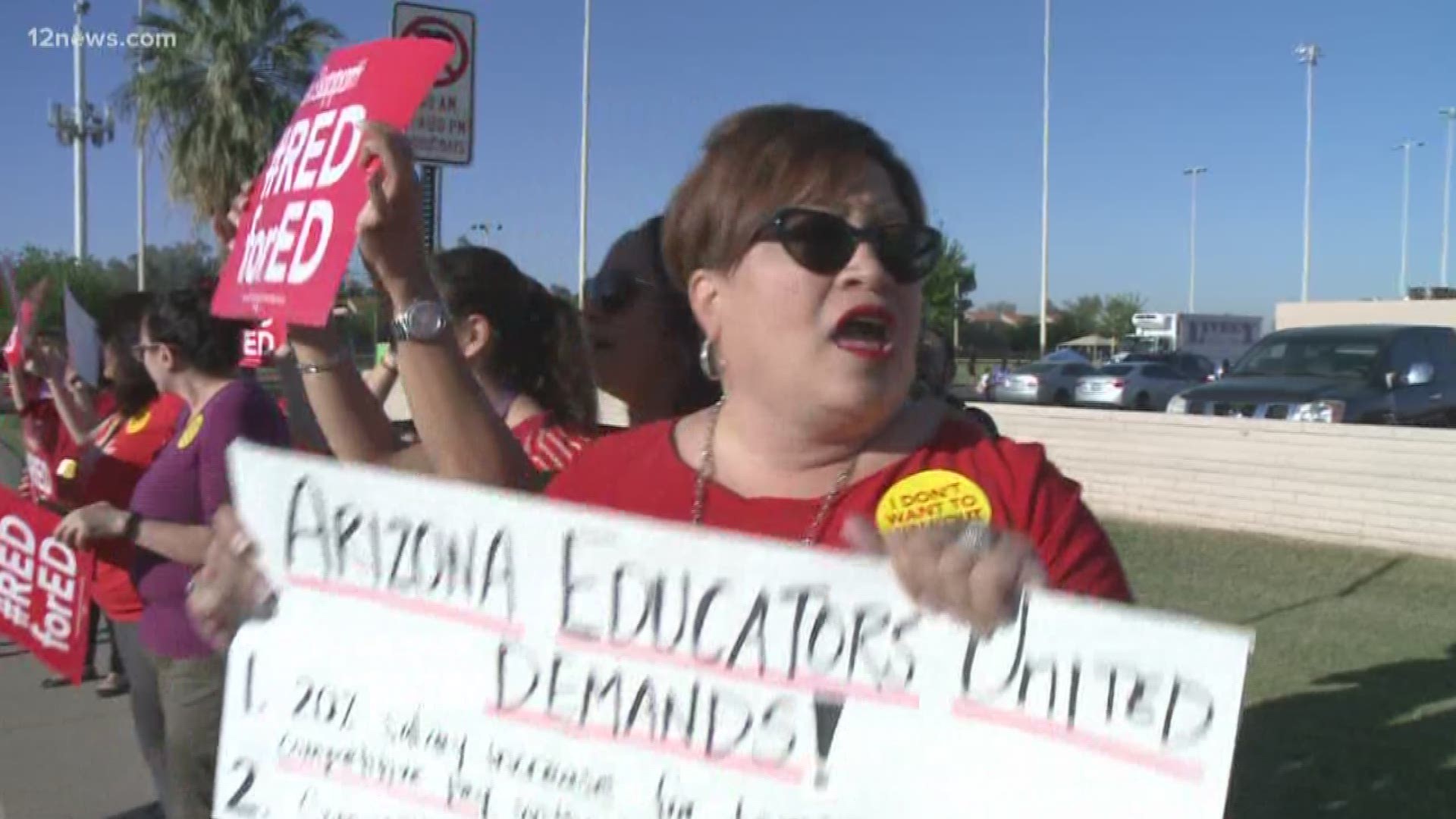 Outside of Mitchell Elementary in the West Valley about 30 teachers chant, hold #RedForEd signs and walk-in hoping their efforts lead to more pay and more money for schools.