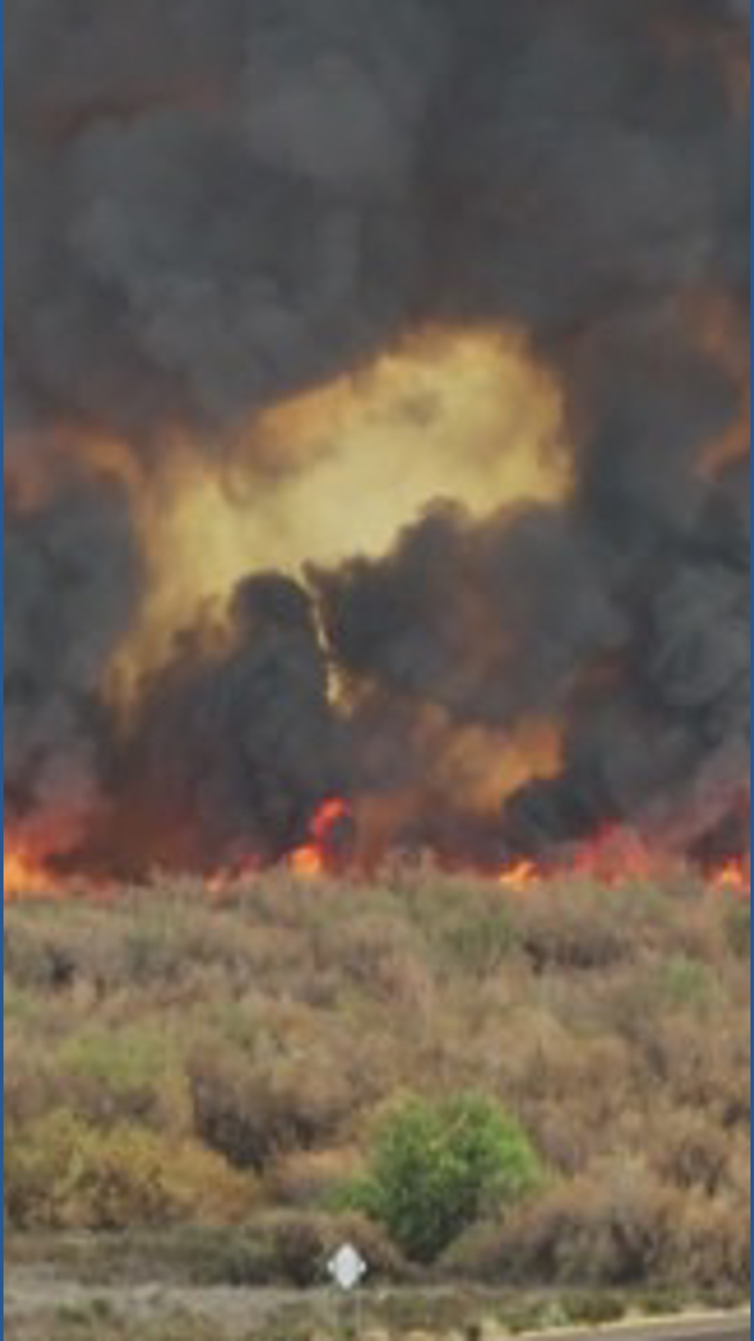Crews battling to contain brush fire near Buckeye | 12news.com