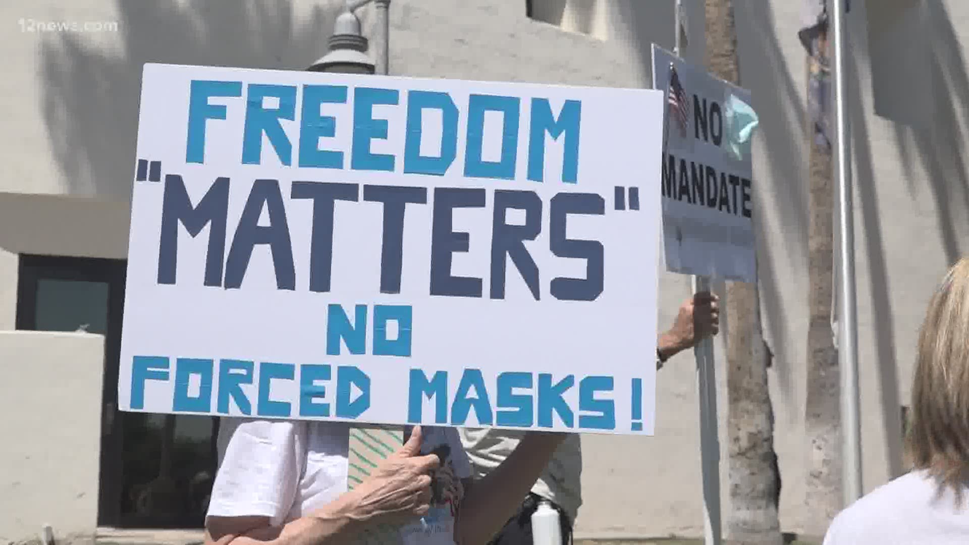 There were two camps of people at a rally in Scottsdale on Wednesday. Those who are opposed to masks. And those who are opposed to being told they have to wear one.