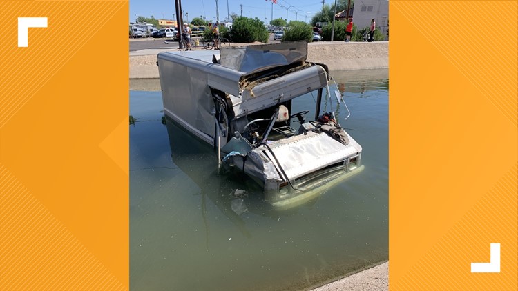 Truck crashes into Mesa canal, takes out light pole