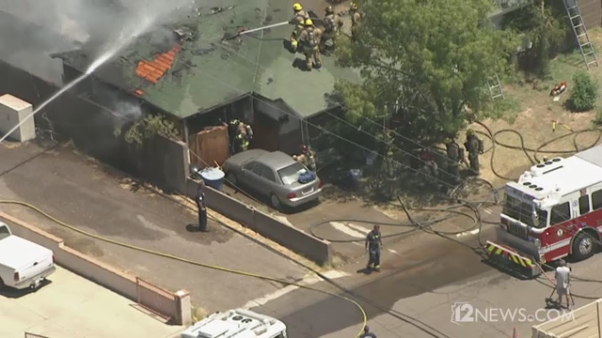 Firefighters battle house fire burning in Tempe; smoke visible for ...