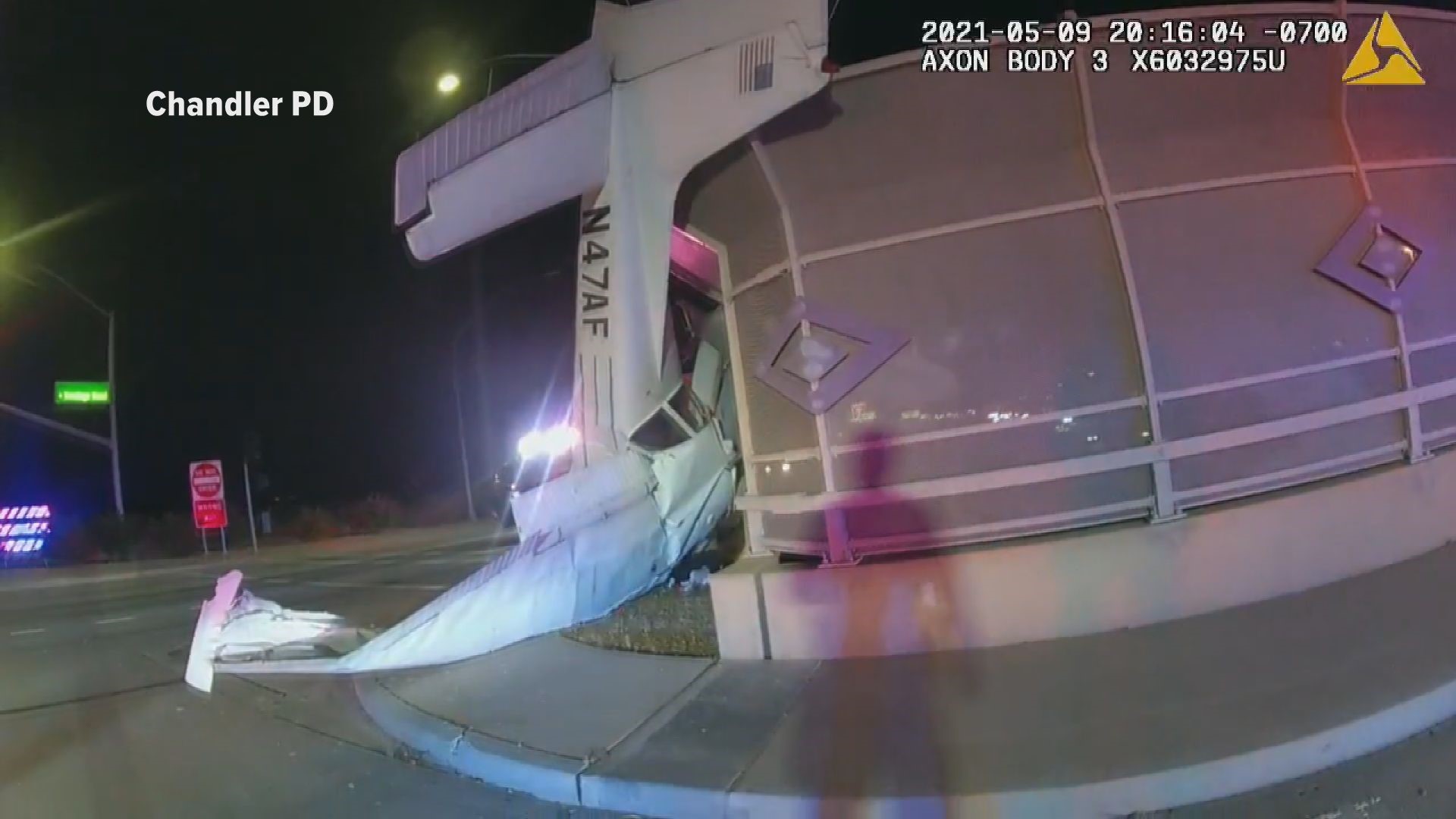 A Chandler police officer's body-worn camera shows the moments he rescued a woman from a plane that crash-landed near the Loop 202 in May.