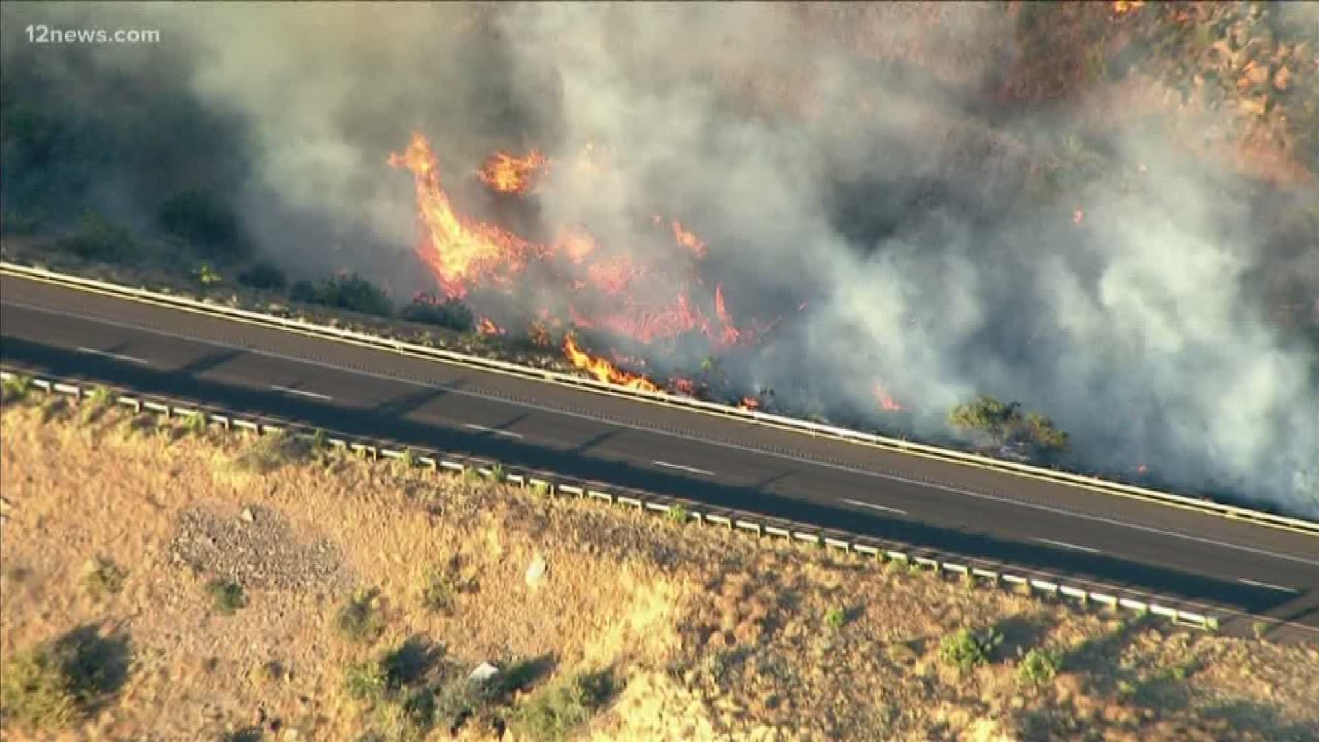 A brush fire burning around 1,000 acres near Interstate 17 has closed the highway in both directions near Sunset Point Friday evening.