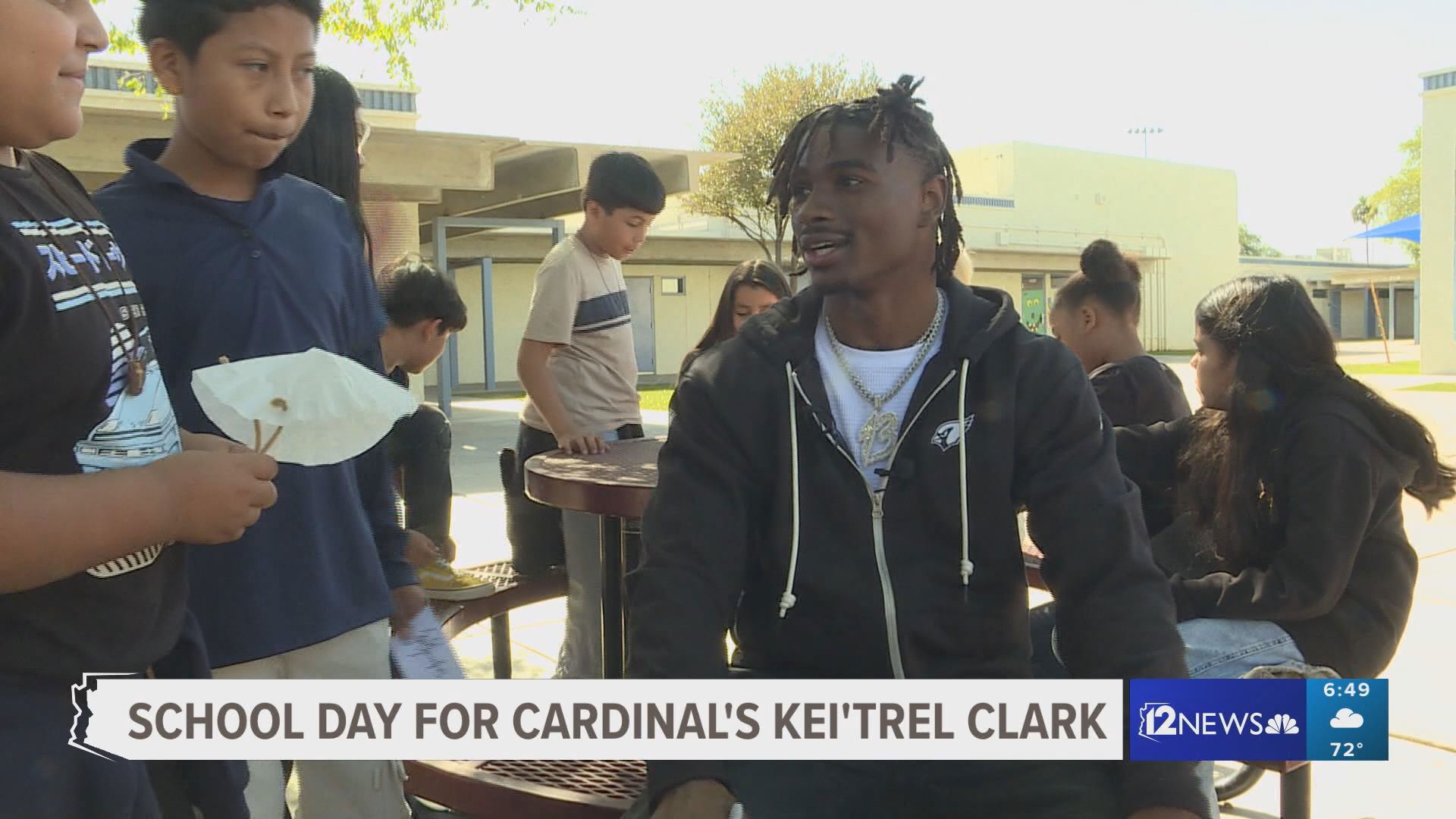 To celebrate national ‘Take an NFL Player to School Day’, Arizona Cardinals cornerback Kei'Trel Clark visits the kids at Bethune Elementary School in south Phoenix.