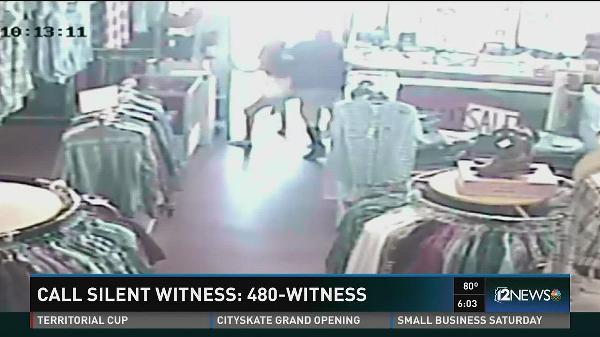 Police say two suspects who pushed an employee out of the way after robbing a Phoenix clothing store are wanted.