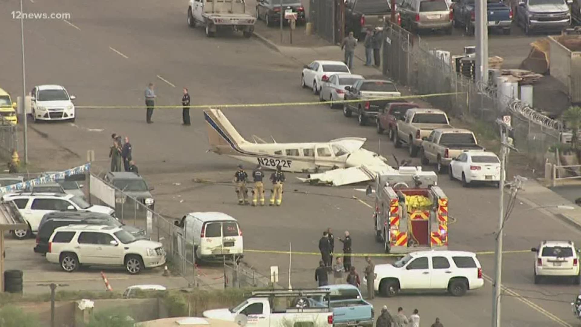 The pilot of a twin engine plane crash landed into an auto lot in North Phoenix Wednesday morning. The pilot and his passenger both walked away from the crash.