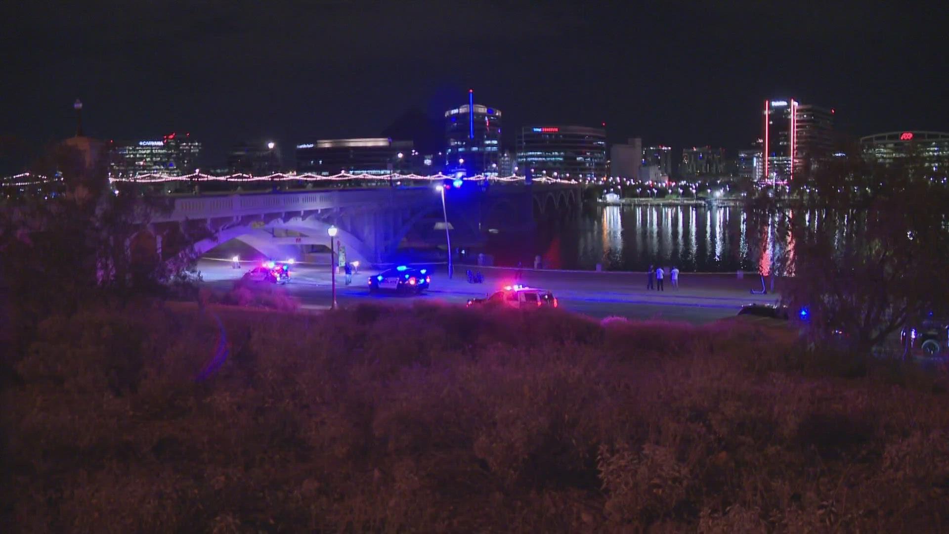 Police are still looking for a man who jumped from the Mill Avenue Bridge into Tempe Town Lake on Sunday. Another man who jumped in was rescued.