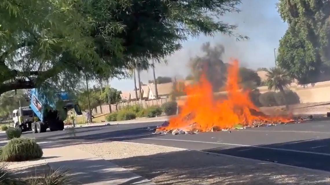 Burning trash haul dumped onto Gilbert road